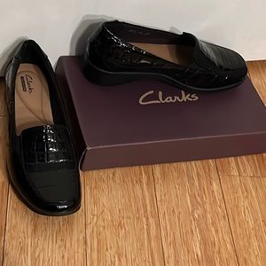 Black Clark’s faux snakeskin shoes